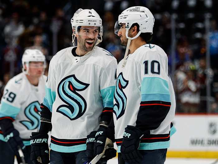 Seattle Kraken defenseman Justin Schultz (4) and Seattle Kraken center Matty Beniers (10) during warmups before game 2 against the Colorado Avalanche in the first round of the 2023 Stanley Cup Playoffs.